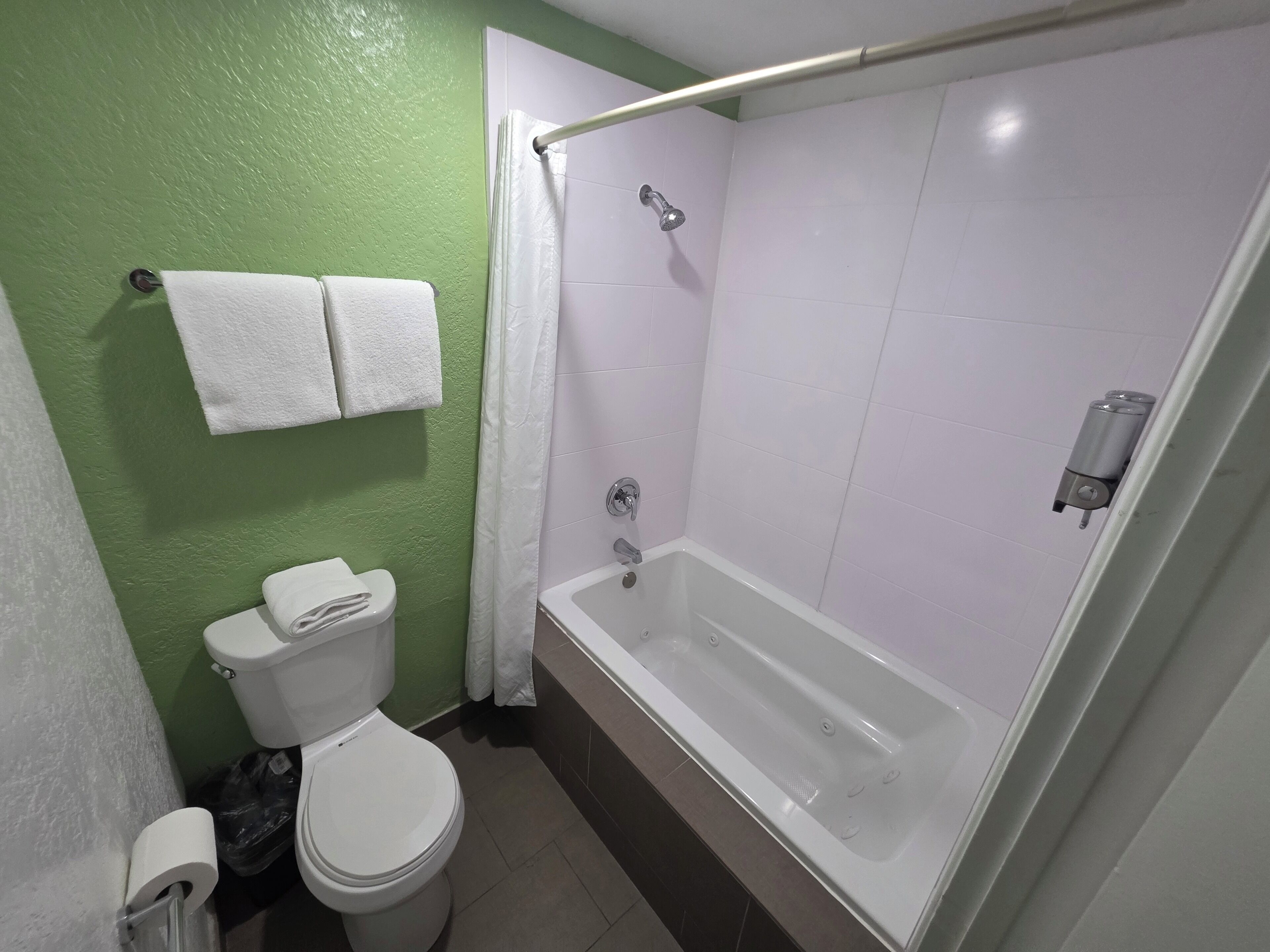 king room with jacuzzi  tub | bathroom | shower, designer toiletries, hair dryer, towels