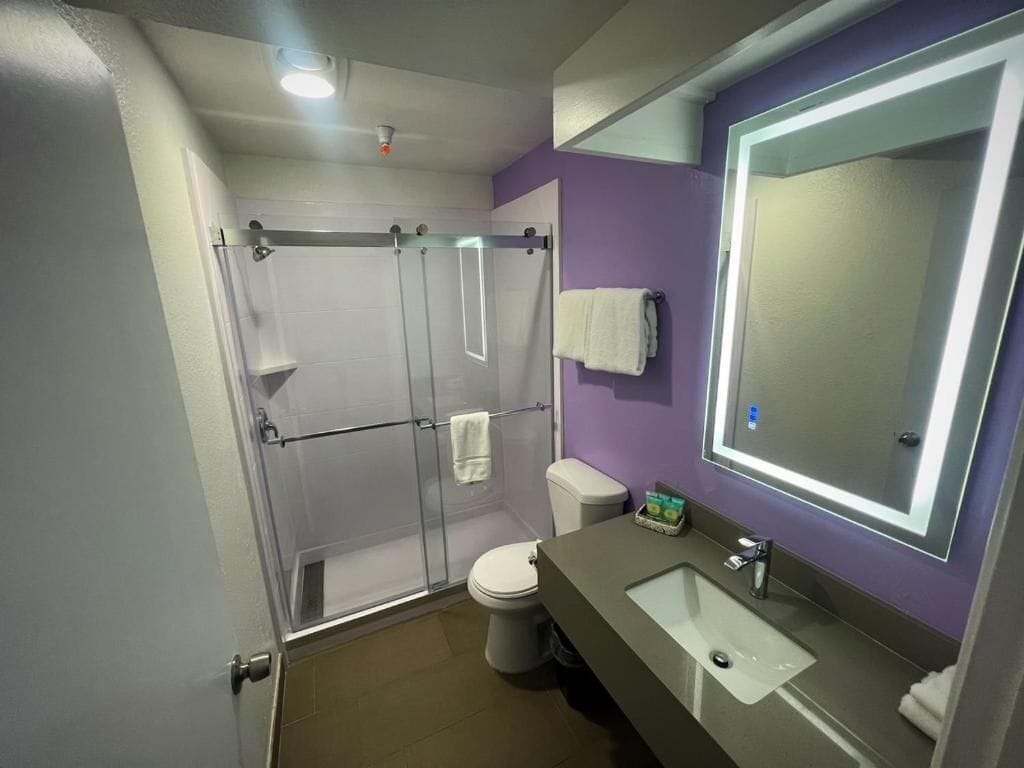city single queen room | bathroom | shower, designer toiletries, hair dryer, towels