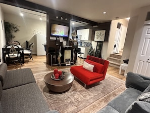 Smart TV, fireplace, books, stereo