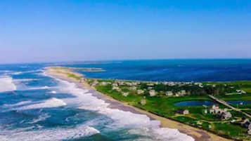 On the beach, sun loungers, beach towels