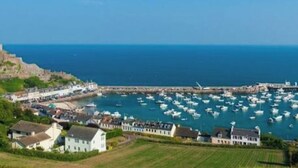 A coastal town with a historic fort, marina, and residential buildings. - Field View, whole annexe (St Clement)