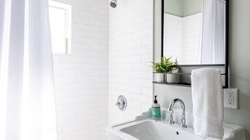 Combined shower/tub, hair dryer, towels, soap