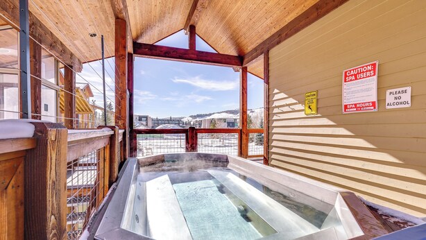 A hot tub with a wooden ceiling and a view of a snowy landscape. - Ski & Explore: Silverthorne Gem w/ Hot Tub Access! (Silverthorne)