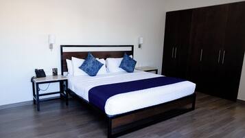 Junior Room | Premium bedding, desk, blackout drapes, iron/ironing board