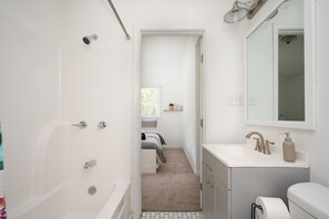 Combined shower/tub, hair dryer, towels, soap
