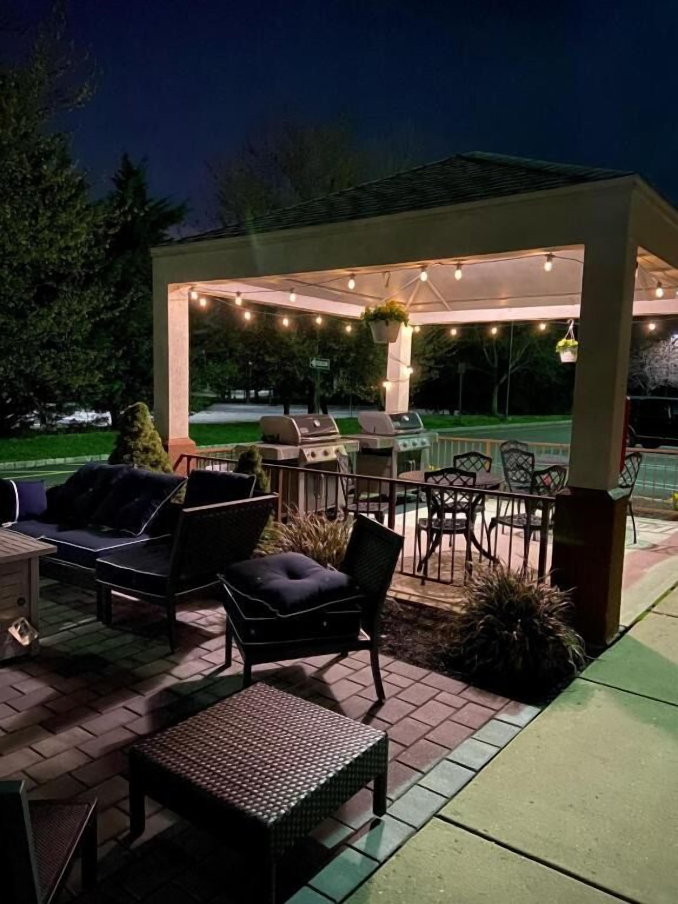 Linger under string lights for a cozy evening hangout.
