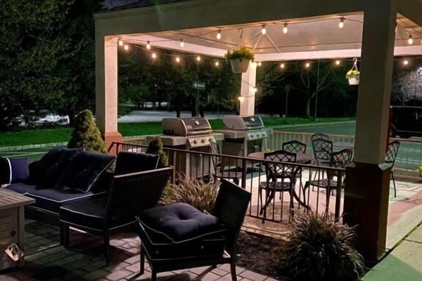 Linger under string lights for a cozy evening hangout.