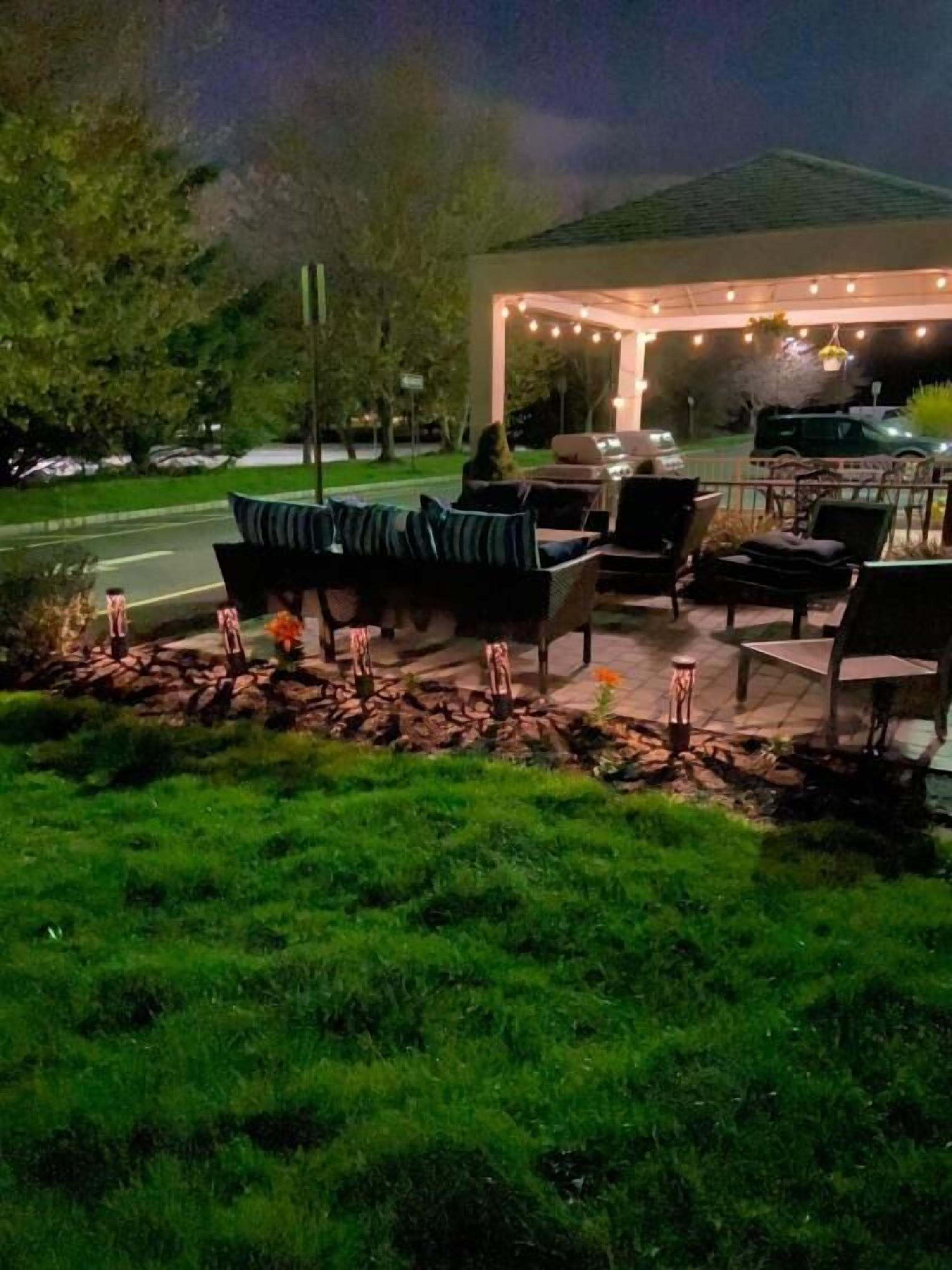 Stretch out on cushioned seating and relax outdoors tonight.