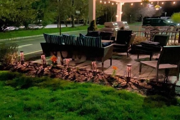 Stretch out on cushioned seating and relax outdoors tonight.