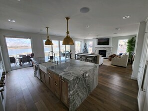Enjoy a spacious open-plan living area with a kitchen, dining space, and comfortable seating.