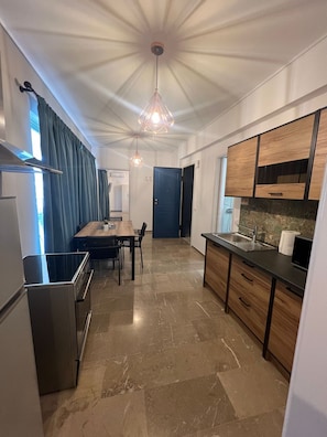 Comfort Apartment | Private kitchen | Fridge, microwave, stovetop, espresso maker