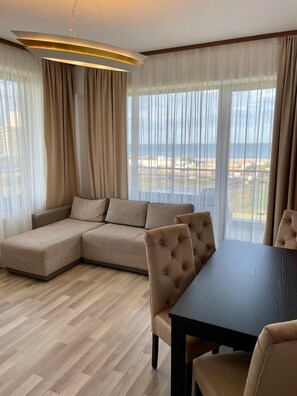 Club Apartment | Living area | 140-cm Smart TV with cable channels, TV
