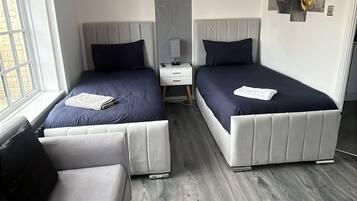 1 bedroom, desk, iron/ironing board, travel cot