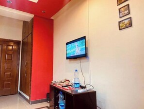 Relax in style with a TV and comfortable seating area.