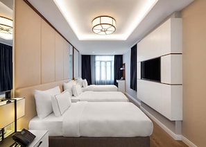 Kamar Triple Standar | Seprai Frette Italia, seprai premium, busa memori, dan minibar