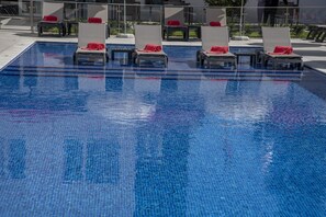 Indoor pool, seasonal outdoor pool, pool umbrellas, sun loungers