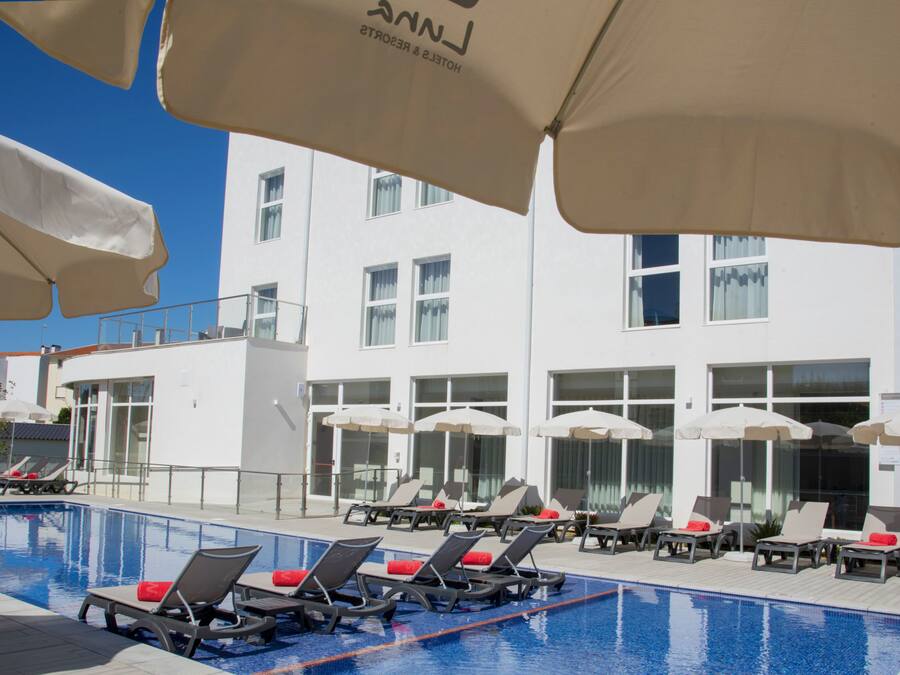 Indoor pool, seasonal outdoor pool, pool umbrellas, pool loungers