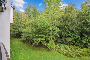 Stroll through the serene garden, surrounded by lush trees and shrubs, and enjoy the peaceful atmosphere.