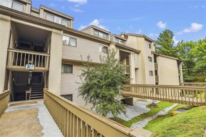 Stunning residential building with a central courtyard and beautifully landscaped grounds.