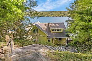 A house with a dock and a view of a lake. - Crane Cove: 4 bedroom Lake Home on Keuka Lake (Penn Yan)