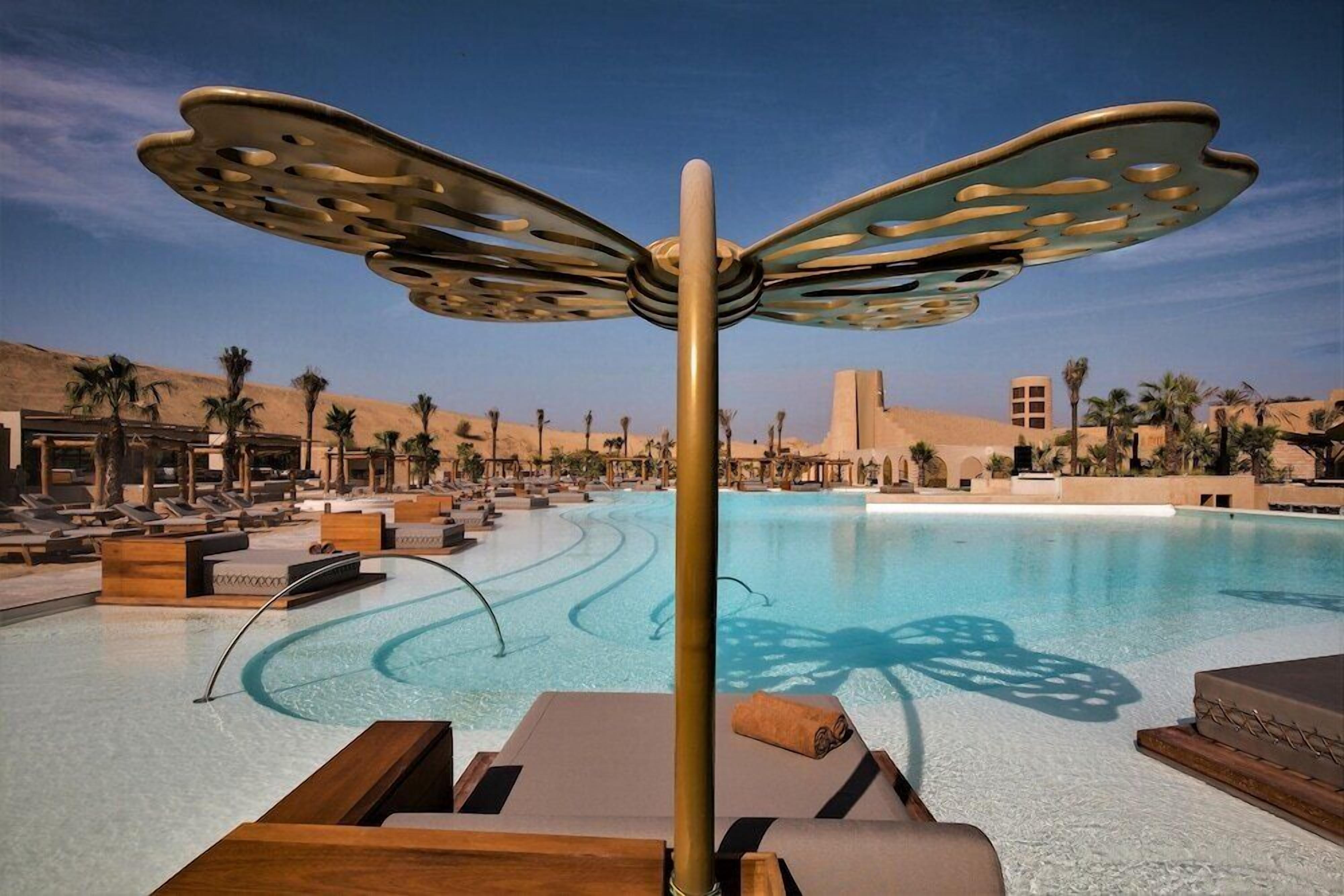 Outdoor pool, open 10:00 AM to 6:30 PM, cabanas (surcharge)