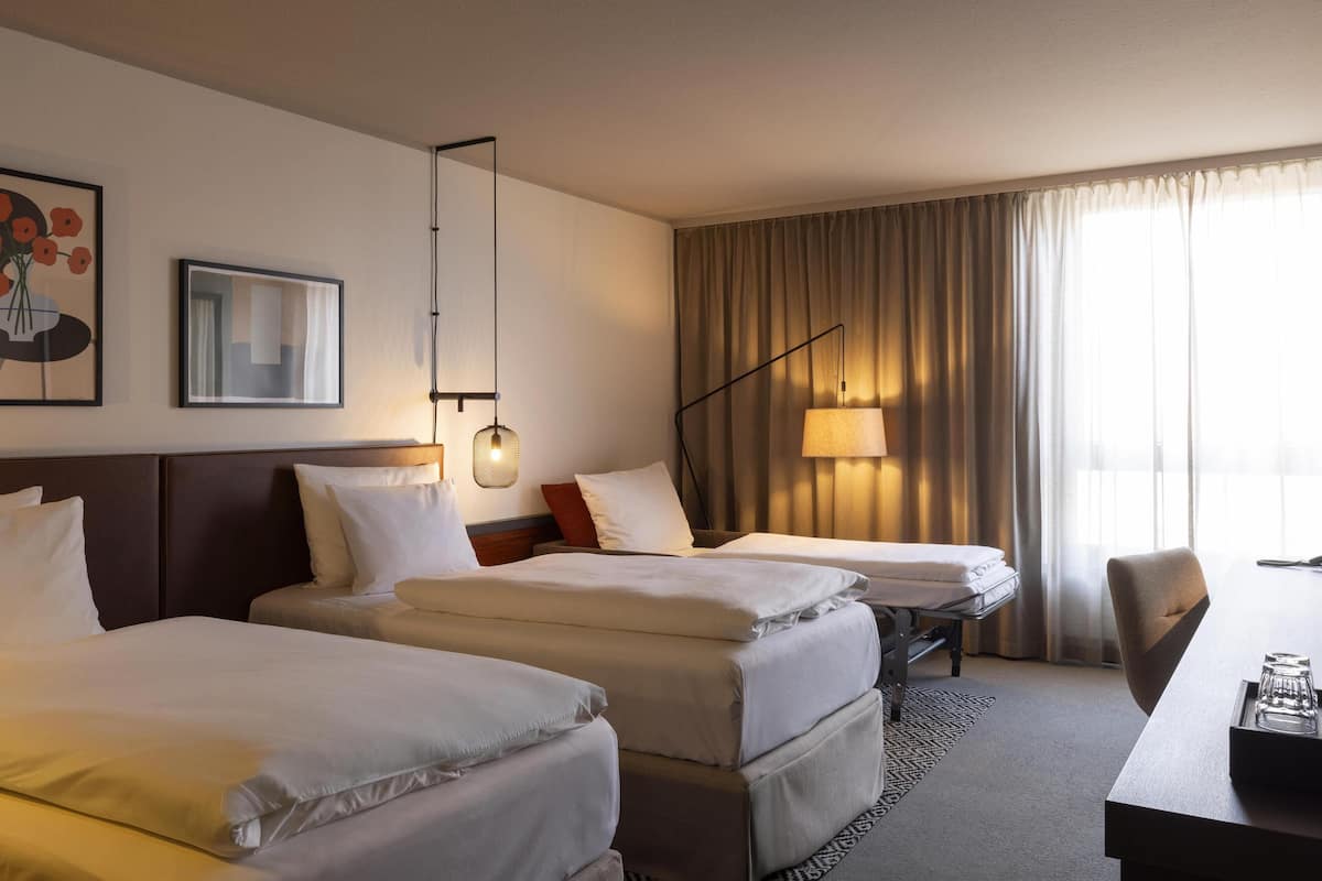 Family Three | In-room safe, desk, laptop workspace, blackout drapes