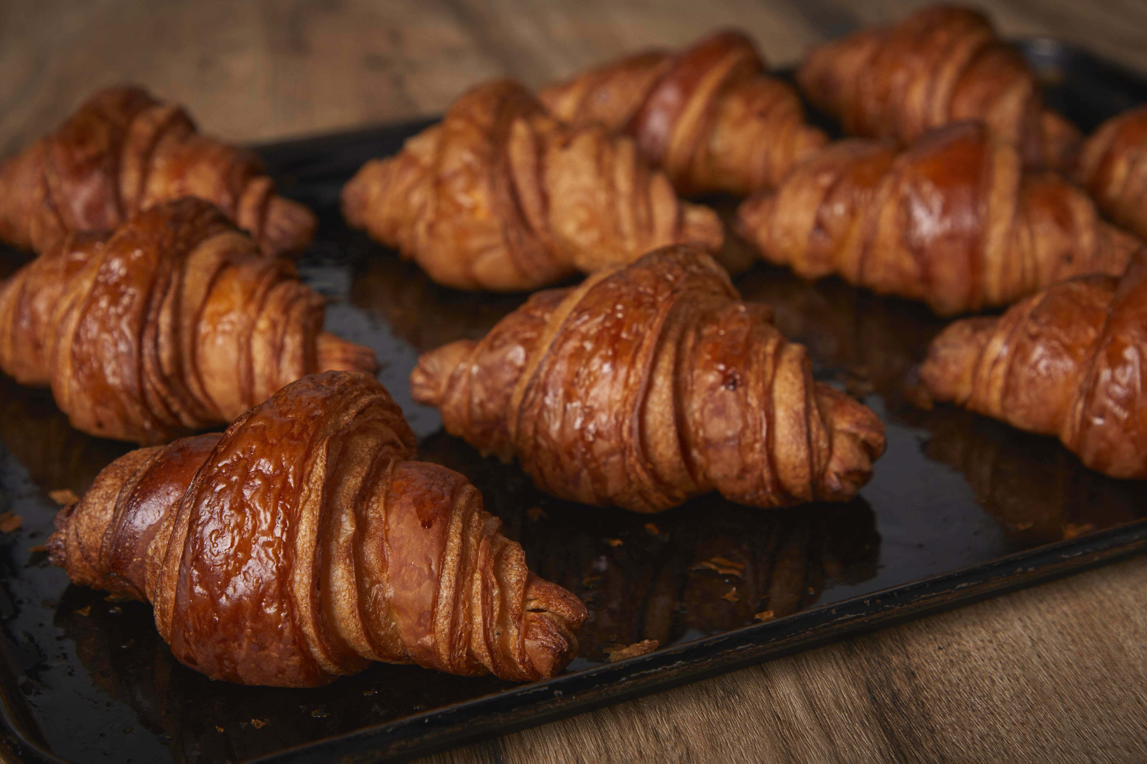 A tray of freshly baked croissants.