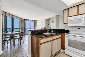 Fridge, microwave, stovetop, coffee/tea maker