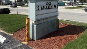 A sign for Coastal Waters at 3509 S Atlantic Ave. - Coastal Waters Cozy Studio unit 102 (New Smyrna Beach)
