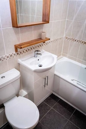 Bathtub, hair dryer, towels