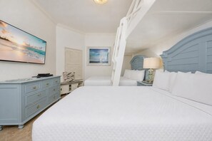A bedroom with a large bed, a dresser, a nightstand, and a painting on the wall. - Beachfront Luxury at The Oasis 1405 | Sleeps 11 (Orange Beach)