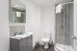 Shower, hair dryer, towels, shampoo