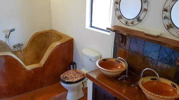 Separate tub and shower, deep soaking tub, hair dryer, towels