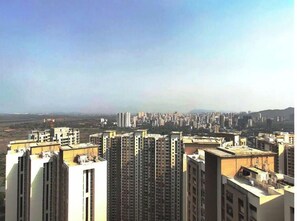 Stylish high-rise apartments with modern architecture and flat, sloped roofs.