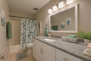 Combined shower/tub, hair dryer, towels, soap