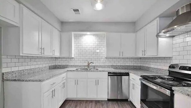 A modern kitchen with white cabinets, a granite countertop, a stainless steel dishwasher, and a black stove. - NEAR TX A&M, HWY 6 , NO CLEANING FEE ,ENTIRE PLaCE (College Station)