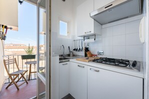 Fridge, microwave, stovetop, coffee/tea maker