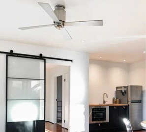 Enjoy cooking in this well-equipped kitchen with a refrigerator, oven, and sink.
