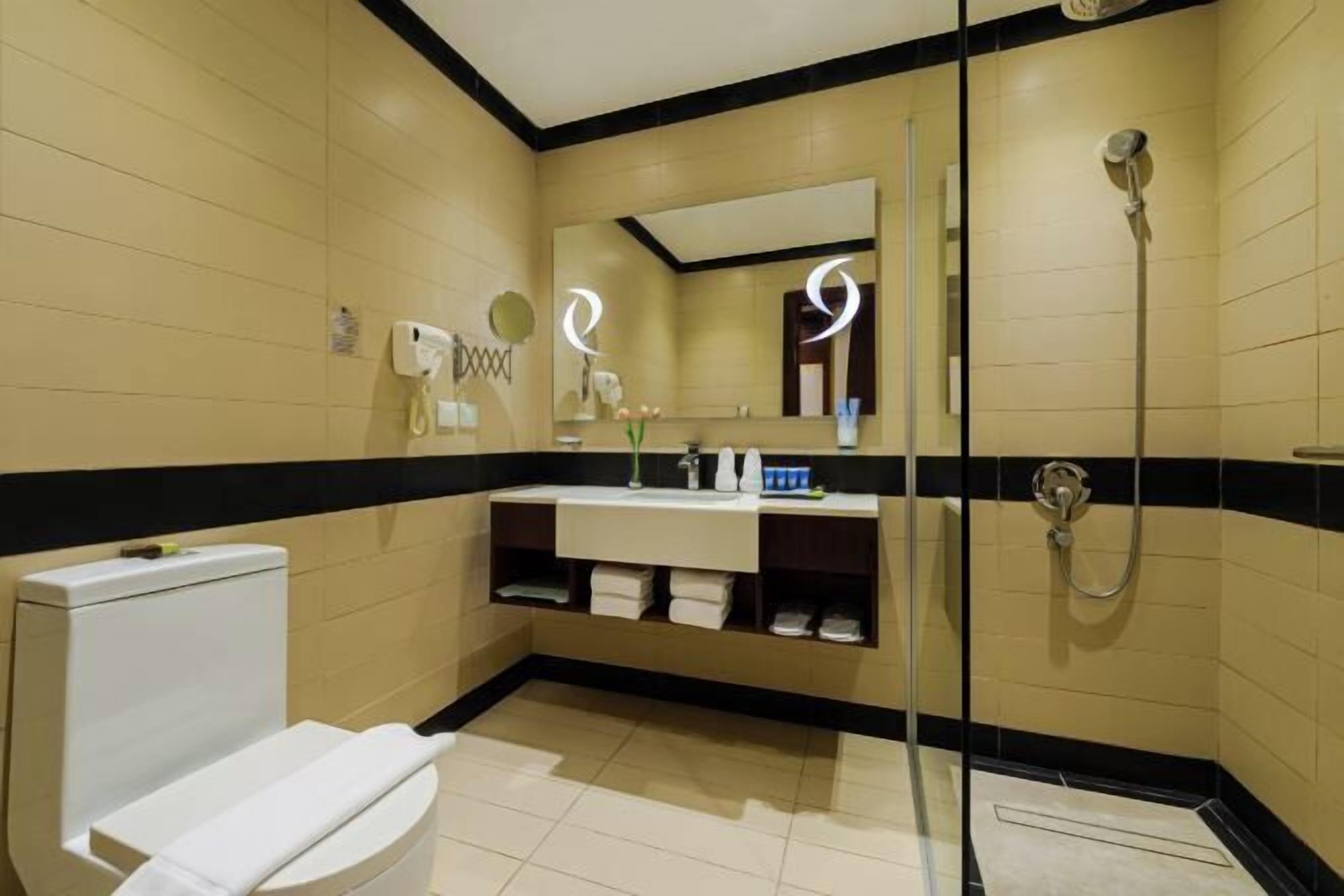 Designer toiletries, hair dryer, bathrobes, slippers