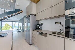 Fridge, oven, stovetop, dining tables