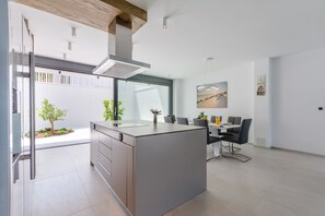 Fridge, oven, stovetop, dining tables