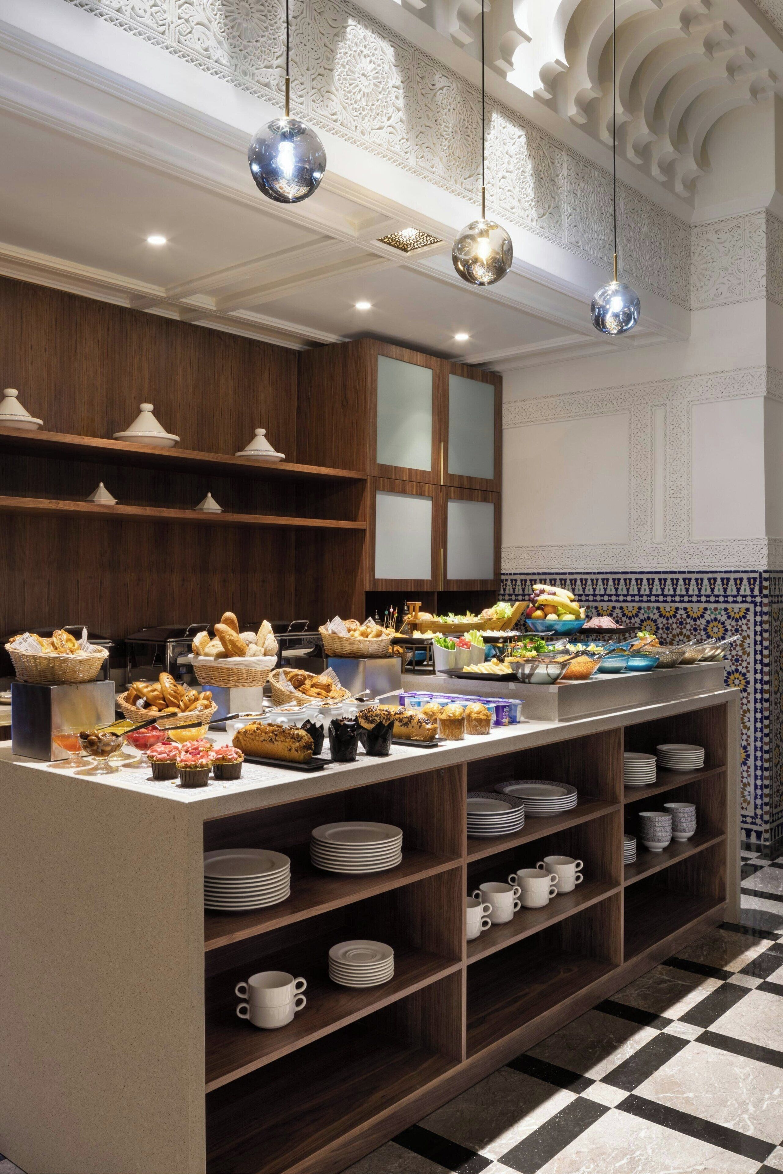 A buffet setup with various food items and a checkered floor.