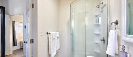 Shower, hair dryer, towels, soap