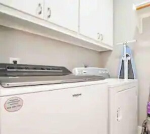 Convenient laundry facilities with a washing machine and dryer.