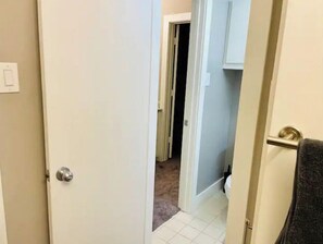 Enter a cozy room with a tiled floor and a door leading to a space.