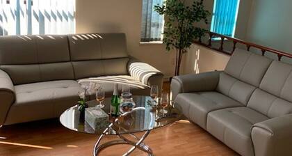 Cozy and cheerful 4-bedroom home with free parking on premises