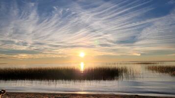 On the beach, sun loungers, beach towels