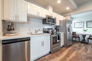 Fridge, microwave, oven, stovetop - Modern 1BR Condo with Bay Views | Walk to Dome + AC | Parking Included (Tacoma)
