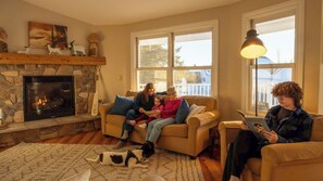 A comfortable seating area, TV, and fireplace create the perfect setting for relaxing evenings.