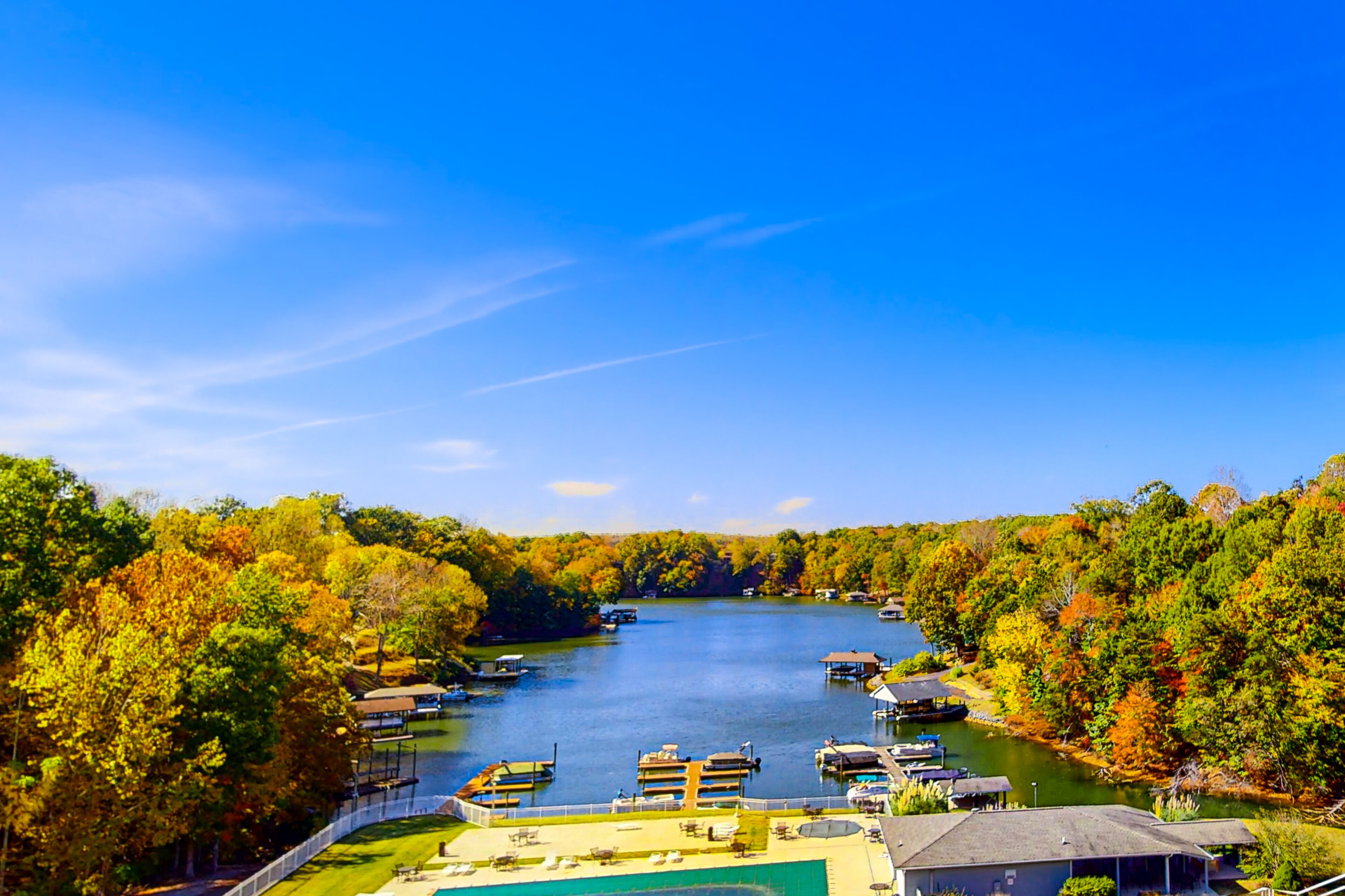 Modern lake-view condo with pool, children's pool, boat trailer storage & launch